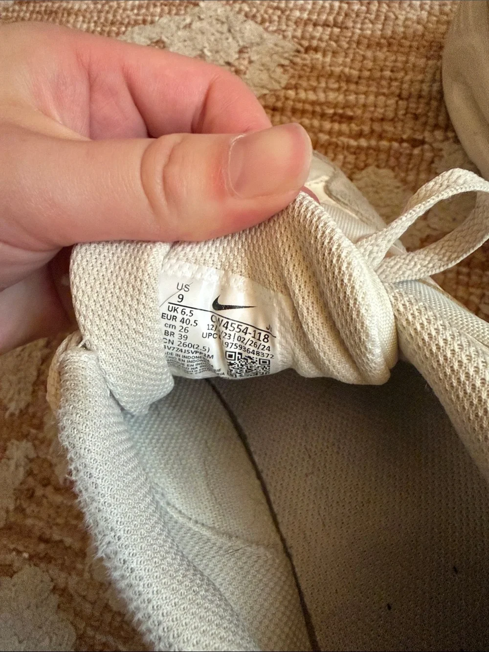 Nike off-white and beige low-top sneakers